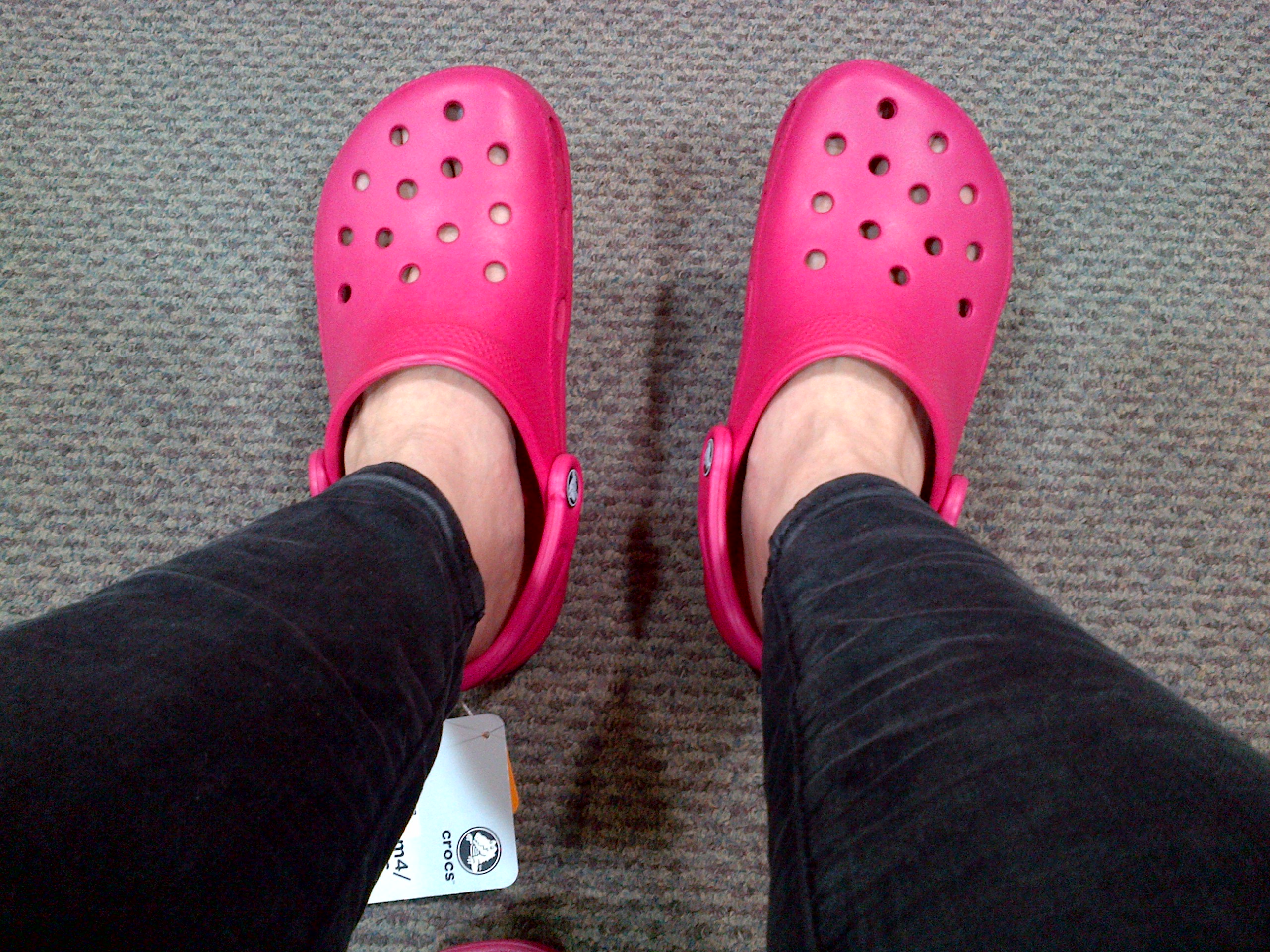 pink crocs on feet